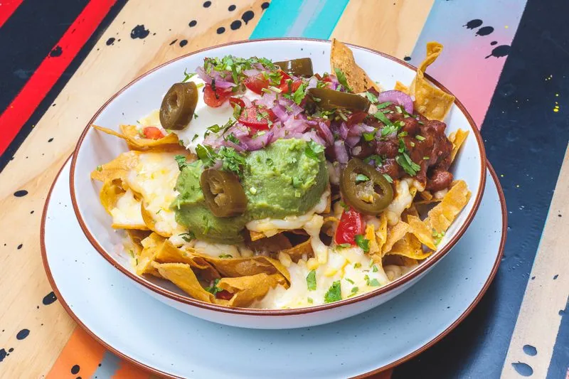 Mexican grill bowl with black beans, guacamole and tortilla chips