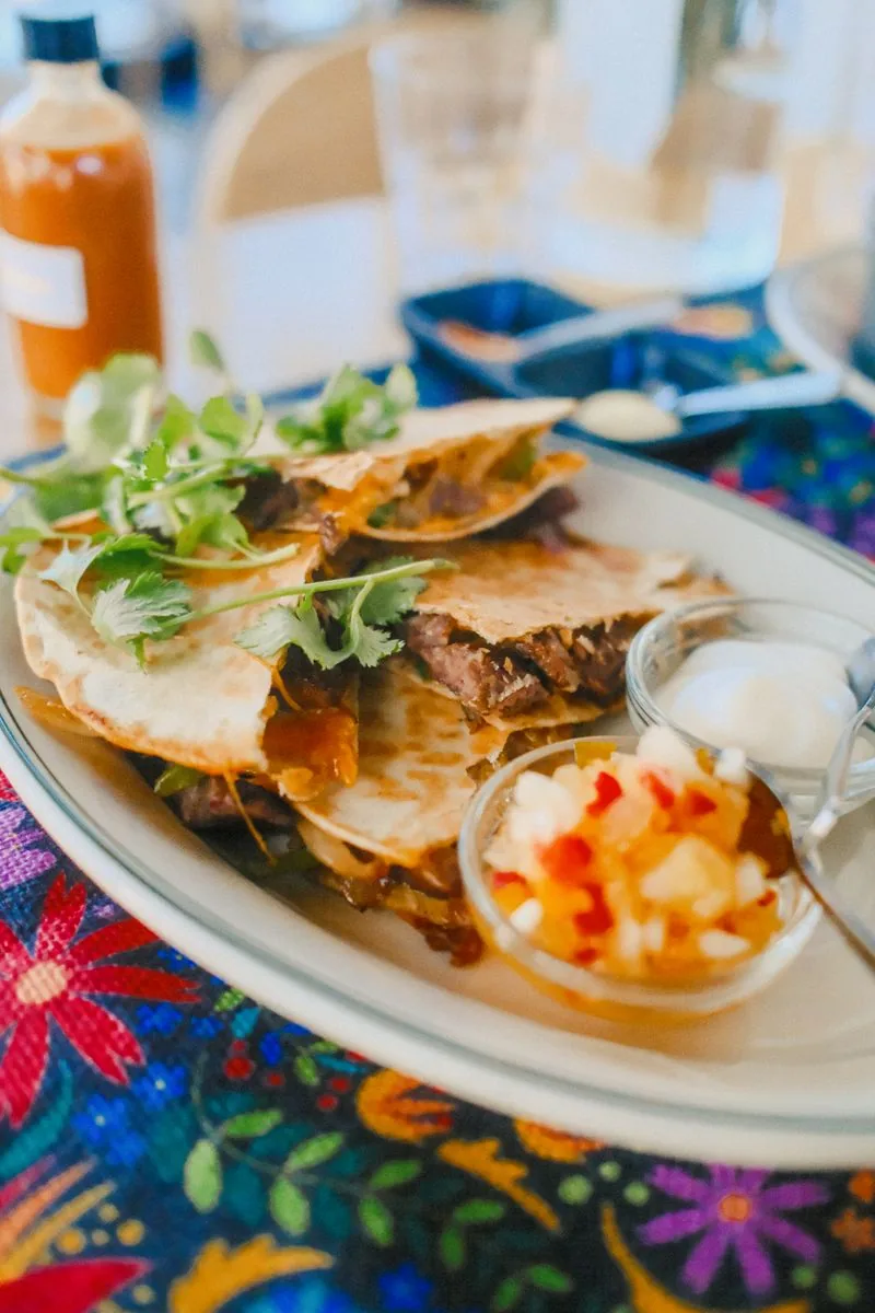 Grilled quesadilla with salsa and crema